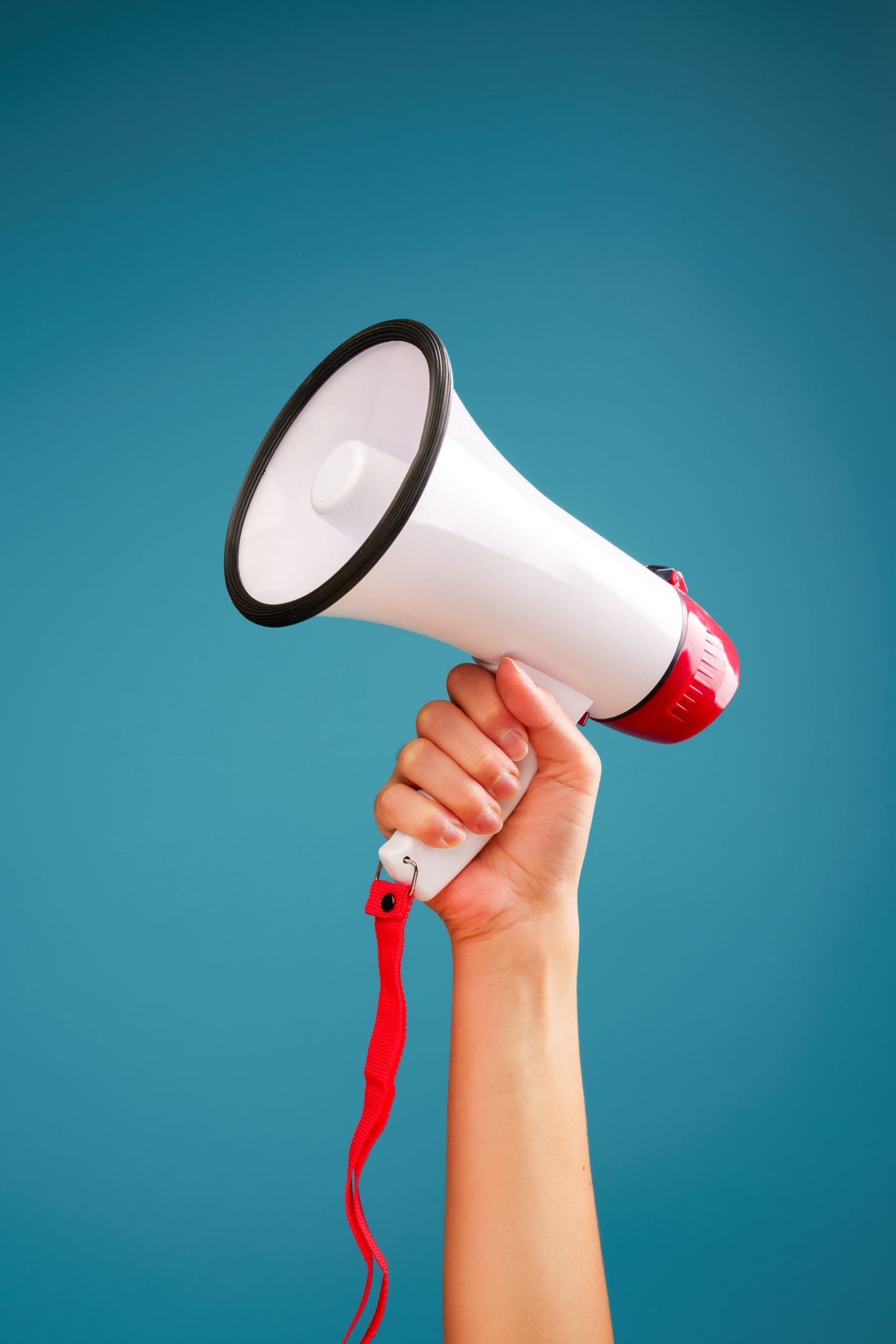 hand holding a bull horn microphone