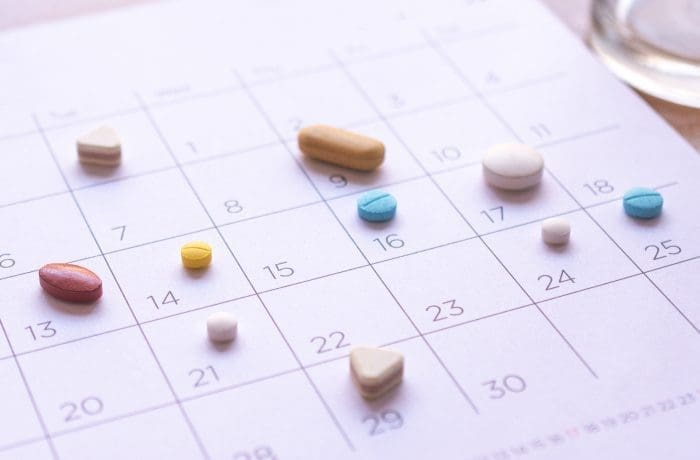 different pills on a calendar