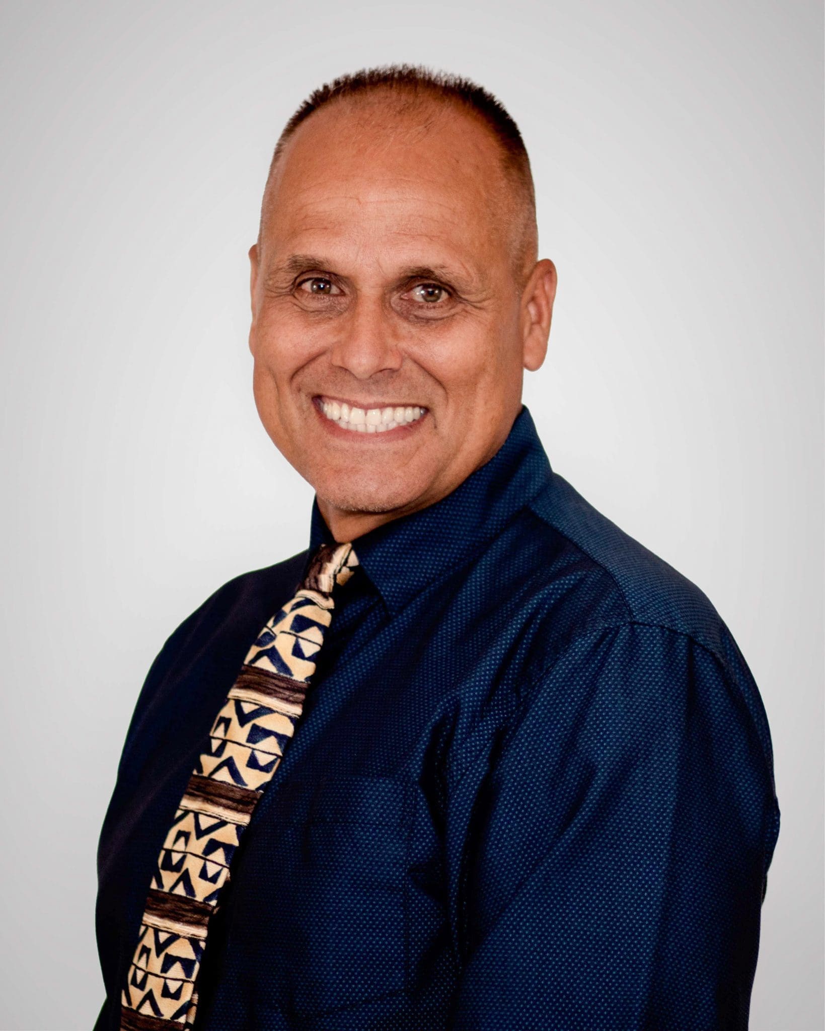 male with blue shirt and tie headshot, located at Virginia Gay Hospital