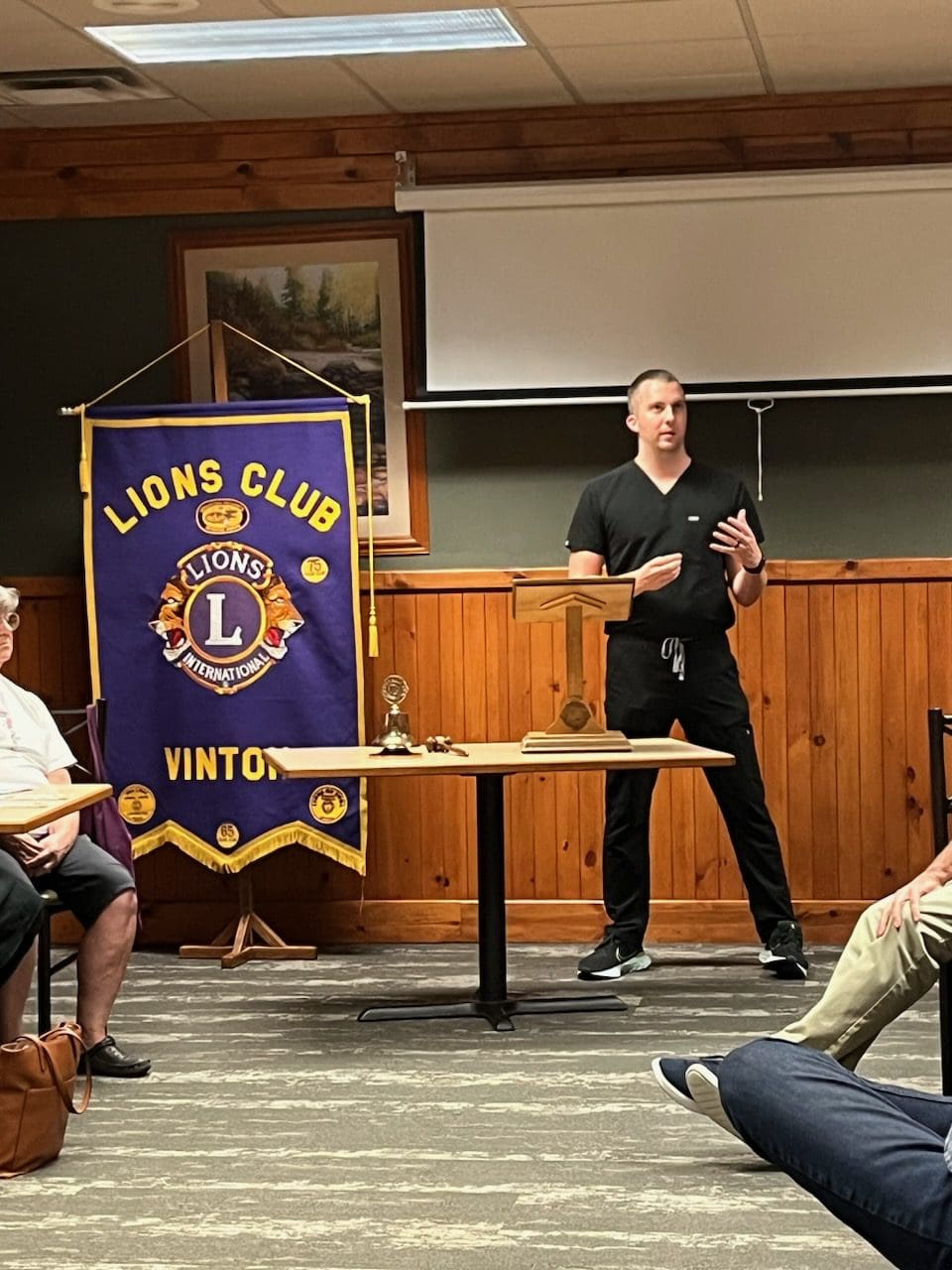 Lion Club Vinton image, man leading presentation