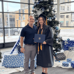 Andrew Dickson, man posing with woman who is graduate